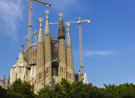 Barcelona, Spain - August 17, 2013  The Sagrada Família west facade with cranes overhead  This building has been in construction since 1882 and is expected to be completed in 2026のeditorial素材