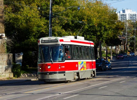 Toronto, Canada - October 12, 2013  A street car in Toronto during the day on a road  This is a popular way to travel around central Toronto by public transportのeditorial素材