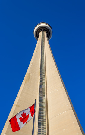 TORONTO, CANADA - 8TH OCTOBER 2013  View of the CN Tower from ground level with the Canadian Flag at the bottom of the towerのeditorial素材