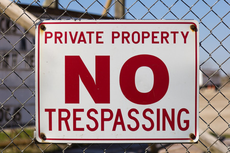 A sign warning that the area is private property and no trespassing allowedの写真素材