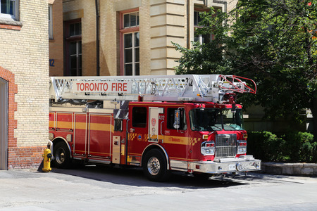 TORONTO, CANADA - 22 JUNE 2014: The outside of a Firestation in Toronto during the day with a Fire Truck parked outsideのeditorial素材