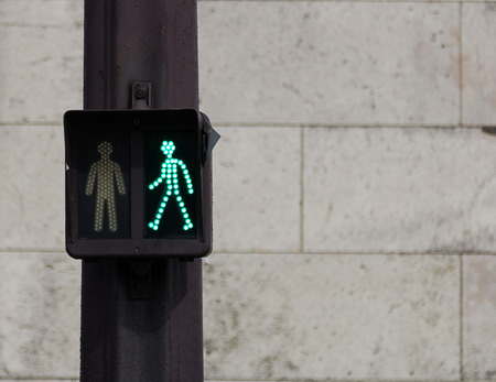 Green man traffic sign on a post in Parisの写真素材