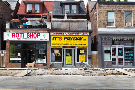 TORONTO, CANADA - 12TH JULY 2014: Road works down Bloor Street in Toronto showing the state of repairs outside shopsのeditorial素材