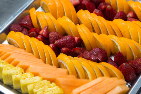 Closeup to a tray of fresh fruitの写真素材