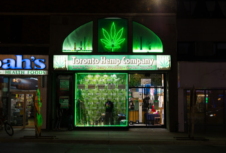 TORONTO, CANADA - 14TH AUGUST 2014: The outside of Toronto Hemp Company at night showing the exterior lit upのeditorial素材