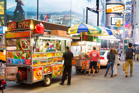 NEW YORK CITY, USA - 30TH AUGUST 2014: Food Trucks in New York City. People can be seen outside the trucksのeditorial素材