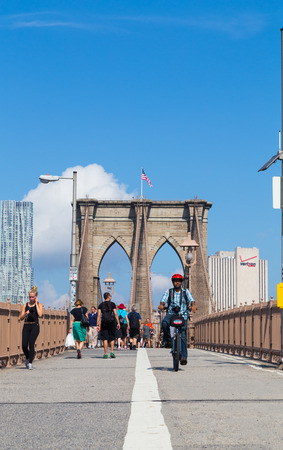 New YORK CITY, USA - 1ST SEPTEMBER 2014: Brooklyn Bridge during the day showing people on the walkway bridgeのeditorial素材