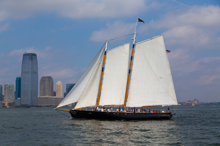 NEW YORK CITY, USA -  31ST AUGUST 2014: A boat sailing in the Hudson River near downtown New York City. People can be seen on the boatのeditorial素材