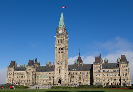 OTTAWA, CANADA -  12TH OCTOBER 2014: The houses of parliament in Ottawa from the distance. People...