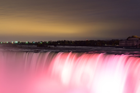NIAGARA FALLS, CANADA - 3RD NOVEMBER 2014: Closeup to the Horseshoe Falls at night showing the lights on the Waterfallのeditorial素材
