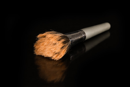 A closeup to a makeup brush