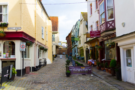 WINDSOR, UK - 1ST FEBRUARY 2014: A street in Windsor during the day, showing various shops and buildingsのeditorial素材