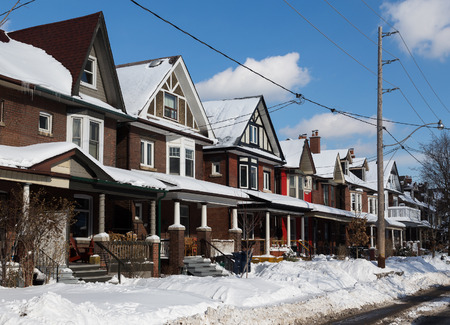 TORONTO, CANADA - 30TH JANUARY 2015: Buildings in Toronto during the winter months snowing snow outsideのeditorial素材