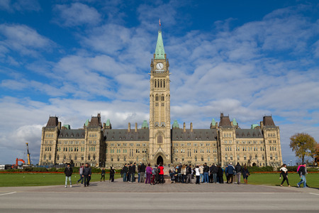 OTTAWA, CANADA -  11TH OCTOBER 2014: The houses of parliament in Ottawa from the distance. People can be seen outsideのeditorial素材