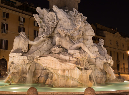 A fountain at Piazza Navona in Rome. The main Fontana dei Quattro Fiumi (Fountain of the Four Rivers) can be seen in the distanceのeditorial素材