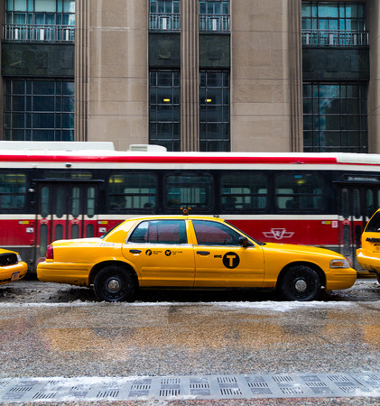 TORONTO, CANADA - 22ND FEBRUARY 2015: A New York City Taxi in downtown Toronto during the day. A Streetcar can be seen behind itのeditorial素材
