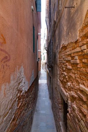 Old streets in Venice showing how narrow some of the streets are.の写真素材