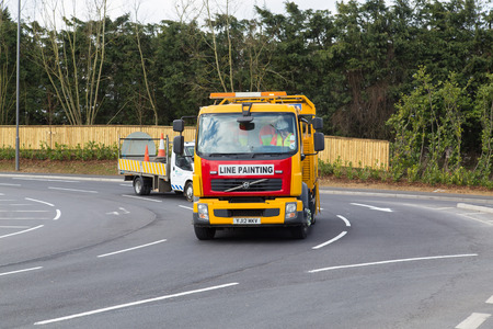 BUCKINGHAM, UK - 6TH MARCH 2015:  A line painting truck on a roundabout in Buckingham during the...