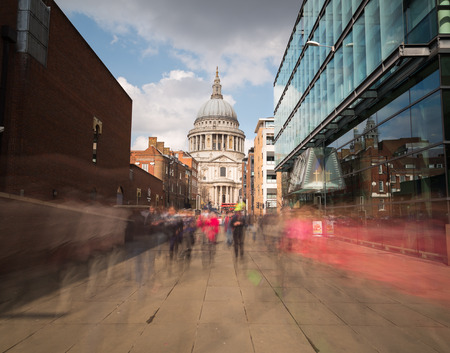 LONDON, UK - 25TH MARCH 2015:  A view towards St PAuls Cathedral in London during the day. Showing the blur of people walking pastのeditorial素材