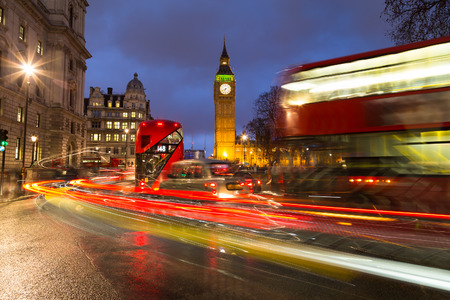 LONDON, UK - 24TH MARCH 2015:  Double Decker Buses, London Taxi and other traffic near Big Ben and Westminster during rush hourのeditorial素材