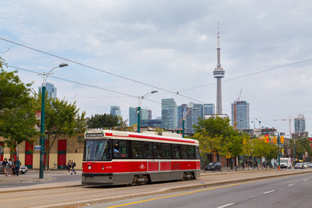 TORONTO, CANADA - 9TH SEPTEMBER 2014: A view of an Old Toronto Street Car during the day. Passengers can be seen on the vehicle.のeditorial素材