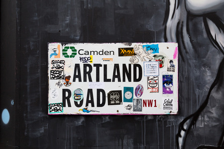 LONDON, UK - 20TH JULY 2015: A sign in London for Hardland Road which has been covered in Stickers.のeditorial素材