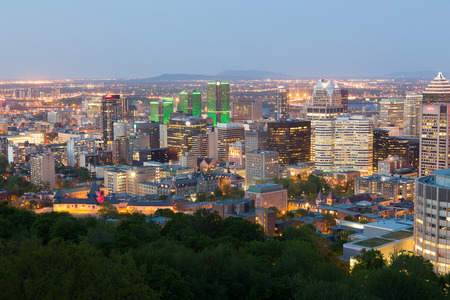 MONTREAL, CANADA - 18TH MAY 2015: A view of the Montreal Skyline at Dusk showing various buildings in the cityのeditorial素材