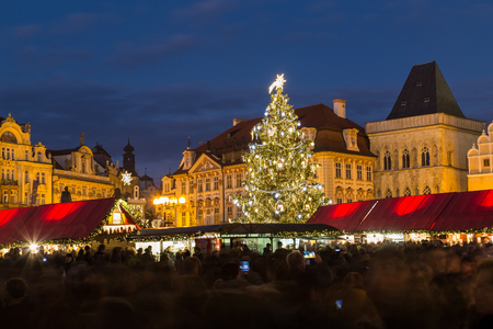 PRAGUE, CZECH REPUBLIC - 6TH DECEMBER 2015: The Christmas Tree and Market Stalls at Prague Old Town Square at Christmas. Large amounts of people can be seen.のeditorial素材