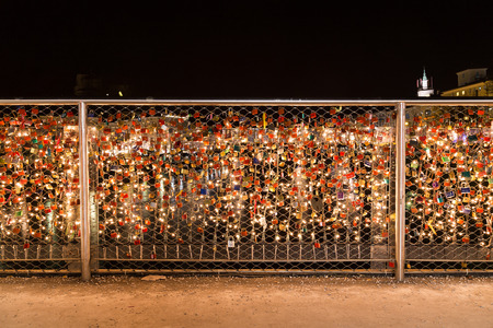 SALBURG, AUSTRIA - 11TH DECEMBER 2015: Padlocks that have been attached to the Makartsteg bridge in Salzburg as seen at night.のeditorial素材