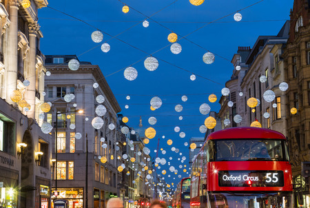 LONDON, UK - 23RD DECEMBER 2015: A view of Oxford Street during the Christmas Season showing buildings, decorations, people and traffic.のeditorial素材