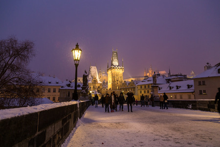 PRAGUE, CZECH REPUBLIC - 6TH JANUARY 2016: A view towards the Tower leading from Charles Bridge in Prague to the Lesser Quarter and Mostecka Street. People can be seen.のeditorial素材