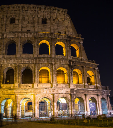 ROME, ITALY - 11TH MARCH 2015: The Colosseum in Rome at night. The blur of people can be seenのeditorial素材
