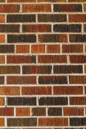 Multi coloured brick wall background and texture. Different bricks can be seen with groves and...