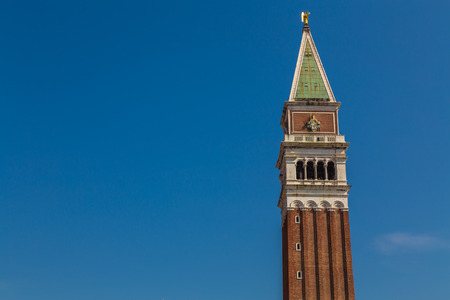 The  Campanile Tower in the San Marco District of Venice during the day. There is space for textの写真素材