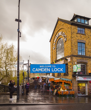 LONDON, UK - 26TH MARCH 2015:  The outside of an entrance to Camden Lock in central London during the day. People can be seen.のeditorial素材