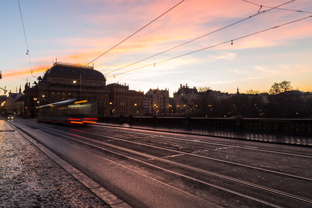 PRAGUE, CZECH REPUBLIC - 6TH DECEMBER 2015: Colourful Sunrise in Prague. The outside of buildings and traffic can be seen.のeditorial素材