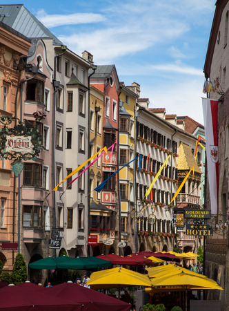 INNSBRUCK, AUSTRIA - 18TH JUNE 2016: Restaurants and patios along Herzog Friedrich Strasse in the central district of Innsbruck during the day.のeditorial素材