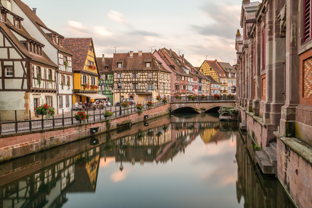 COLMAR, FRANCE - 30TH JULY 2016: A view of colourful timber framed buildings along Little Venice in Colmar. Reflections can be seen in the River Lauchのeditorial素材