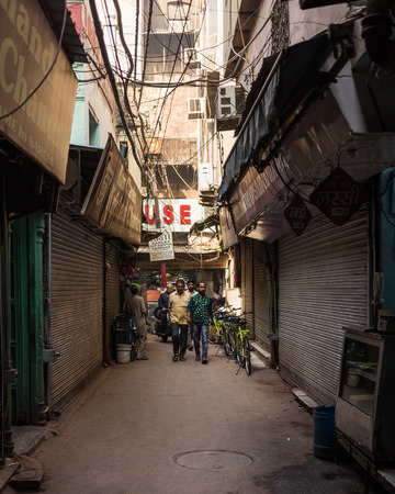 DELHI, INDIA - 19TH MARCH 2016: A view along allyways in central Delhi. People can be seen.のeditorial素材