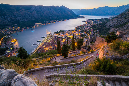 KOTOR, MONTENEGRO - 12TH AUGUST 2016: A view of the Kotor Skyline in Montenegro at night. Showing the glow of buildings and boats on the water.のeditorial素材