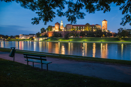 KRAKOW, POLAND -  15TH OCTOBER 2016: A view of the outside of Wawel Royal Castle in Krakow at night from across the river Vistulaのeditorial素材
