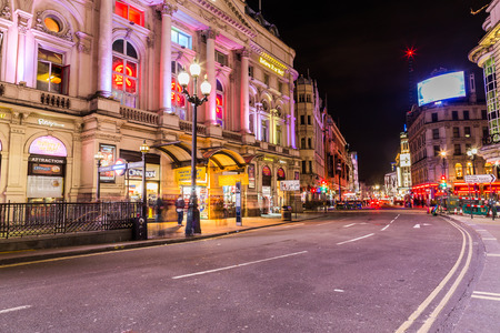LONDON, UK - 8TH MARCH 2015:  Coventry Street near Picadilly Circus at night. The blur of people can be seen.のeditorial素材