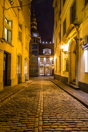 RIGA, LATVIA - 1ST JAN 2017: A view along streets in Riga towards the Riga Dome Cathedral at night.のeditorial素材