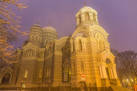 RIGA, LATVIA - 2ND JAN 2017: The outside of the Cathedral of The Nativity in Riga at night in the winter showing the intricate design of the facade.のeditorial素材