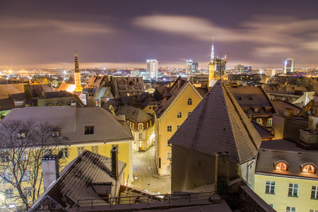 A view of the Tallinn skyline during the winter from the Kohtuotsa viewing platform at night. Lots of snow can be seen.の写真素材