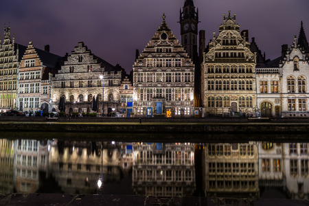 GHENT, BELGIUM - 18TH FEB 2016: Ghent from the Graslei and Korenlei at night. The facades of buildings can be seen.のeditorial素材