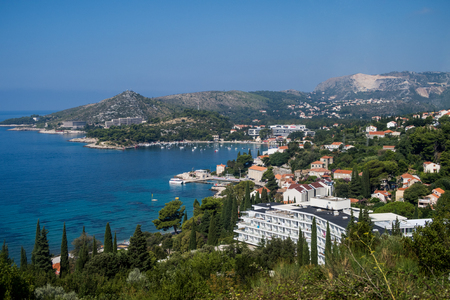 DUBROVNIK, CROATIA - 10TH AUGUST 2016: Buildings and Towns along the Croatian Coast during the day in the summer. Boats, hills and the adriatic sea can be seen.のeditorial素材
