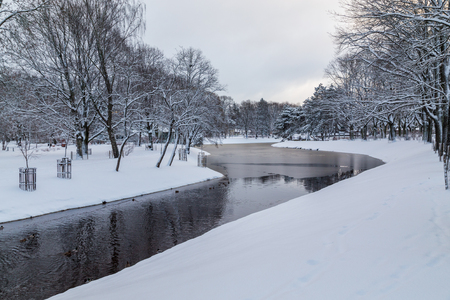 RIGA, LATVIA - 3RD JAN 2017:  Kronvalda Parks in central Riga during the day in the winter showing lots of snow.のeditorial素材