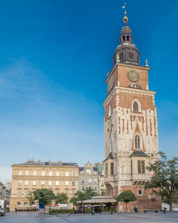 KRAKOW, POLAND -  15TH OCTOBER 2016: Old Town Hall Tower and Rynek Glowny in Krakow in the morning. People can be seen.のeditorial素材