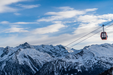 Mountains and a Gondola at a ski resort in the winterの写真素材